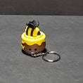 Load image into Gallery viewer, 3D Printed Bee in a Honey Pot Fidget Clicker Keychain
