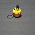 Load image into Gallery viewer, 3D Printed Bee in a Honey Pot Fidget Clicker Keychain
