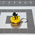 Load image into Gallery viewer, 3D Printed Bee in a Honey Pot Fidget Clicker Keychain
