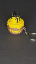 Load and play video in Gallery viewer, 3D Printed Bee in a Honey Pot Fidget Clicker Keychain
