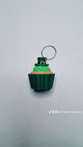 Load image into Gallery viewer, 3D Printed St Patrick's Day Cupcake Fidget Clicker Keychain
